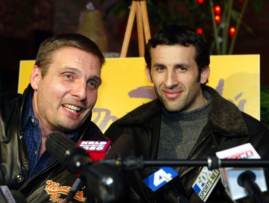 French basketball player Antoine Rigaudeau (R) and Dallas Mavericks' assistant coach Donnie Nelson (L) talk to the press at a local restaurant after signing a multi-year contract with the Dallas Mavericks 15 January 2003 in Grapevine, Texas. AFP PHOTO/Paul BUCK (Photo by PAUL BUCK / AFP)