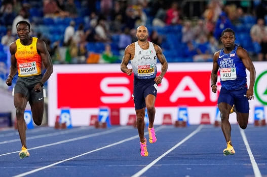 Germany's Owen Ansah, Italy's Lamont Marcell Jacobs and Britain's Jeremiah Azu race in the men's 100 meters final at the European Athletics Championships in Birmingham, England, Tuesday, Aug. 11, 2026. (AP Photo/Petr David Josek)