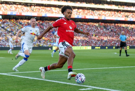 CORRECTION / Manchester United's Dutch forward #11 Joshua Zirkzee controls the ball whilst under pressure from Leeds United's English midfielder #08 Sean Longstaff during a pre season friendly football match between Manchester United and Leeds at Croke Park in Dublin, Ireland, on August 12, 2026. (Photo by Paul Faith / AFP) / RESTRICTED TO EDITORIAL USE. No use with unauthorized audio, video, data, fixture lists, club/league logos or 'live' services. Online in-match use limited to 120 images. An additional 40 images may be used in extra time. No video emulation. Social media in-match use limited to 120 images. An additional 40 images may be used in extra time. No use in betting publications, games or single club/league/player publications. / The erroneous mention[s] appearing in the metadata of this photo by Paul Faith has been modified in AFP systems in the following manner: [dateline as Dublin in metadata] instead of [Manchester]. Please immediately remove the erroneous mention[s] from all your online services and delete it (them) from your servers. If you have been authorized by AFP to distribute it (them) to third parties, please ensure that the same actions are carried out by them. Failure to promptly comply with these instructions will entail liability on your part for any continued or post notification usage. Therefore we thank you very much for all your attention and prompt action. We are sorry for the inconvenience this notification may cause and remain at your disposal for any further information you may require.