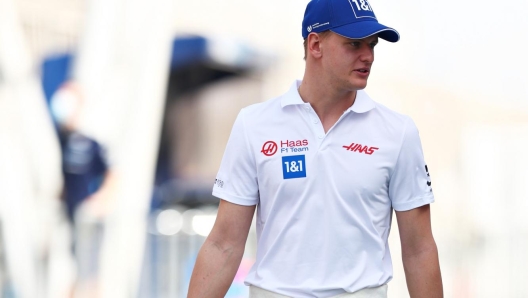 BAHRAIN, BAHRAIN - MARCH 10: Mick Schumacher of Germany and Haas F1 walks in the Paddock during Day One of F1 Testing at Bahrain International Circuit on March 10, 2022 in Bahrain, Bahrain. (Photo by Lars Baron/Getty Images)