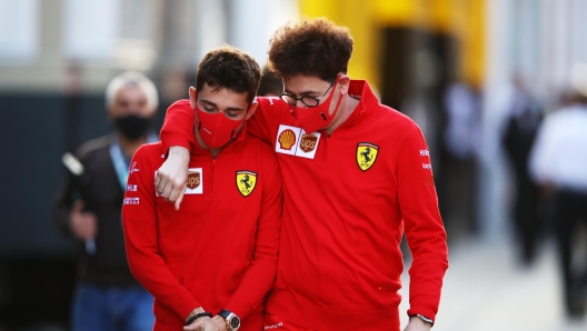 IMOLA, ITALY - OCTOBER 30: Scuderia Ferrari Team Principal Mattia Binotto embraces Charles Leclerc of Monaco and Ferrari as they walk in the Paddock during previews ahead of the F1 Grand Prix of Emilia Romagna at Autodromo Enzo e Dino Ferrari on October 30, 2020 in Imola, Italy. (Photo by Mark Thompson/Getty Images)