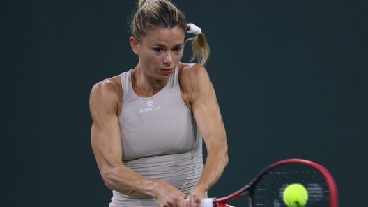 INDIAN WELLS, CALIFORNIA - MARCH 10: Camila Giorgi of Italy plays a backhand in her match against Jessica Pegula of the united States during the BNP Parisbas at the Indian Wells Tennis Garden on March 10, 2023 in Indian Wells, California.   Harry How/Getty Images/AFP (Photo by Harry How / GETTY IMAGES NORTH AMERICA / Getty Images via AFP)