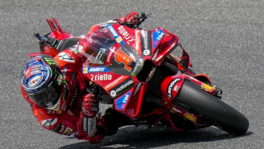 Italian rider Francesco Bagnaia of the Ducati Lenovo Team steers his motorcycle during the MotoGP race of the Grand Prix of Italy at the Mugello circuit in Scarperia, Italy, Sunday, June 11, 2023. (AP Photo/Luca Bruno)