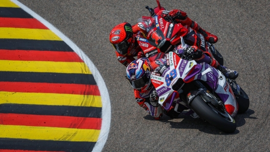 Winner Ducati Pramac Racing Team's Spanish rider Jorge Martin (front) and second-placed Ducati Lenovo Team's Italian rider Francesco Bagnaia race during the MotoGP German motorcycle Grand Prix at the Sachsenring racing circuit in Hohenstein-Ernstthal near Chemnitz, eastern Germany, on June 18, 2023. (Photo by Ronny Hartmann / AFP)