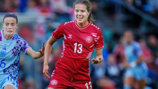 Denmark's Sofie Junge Pedersen and Spain's María Perez vie for the ball during the friendly international match between Denmark and Spain at Gladsaxe Stadium on July 5, 2023, ahead of the upcoming women's World Cup. (Photo by Liselotte Sabroe / Ritzau Scanpix / AFP) / Denmark OUT