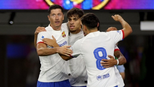 INGLEWOOD, CALIFORNIA - JULY 26: Robert Lewandowski #9 of FC Barcelona celebrates his goal with Abde Ezzalzouli #16 and Pedri #8, to take a 1-0 lead over Arsenal during the first half of a pre-season friendly between Arsenal and FC Barcelona at SoFi Stadium on July 26, 2023 in Inglewood, California.   Harry How/Getty Images/AFP (Photo by Harry How / GETTY IMAGES NORTH AMERICA / Getty Images via AFP)