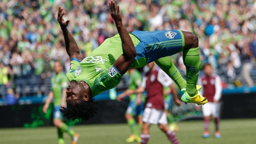 SEATTLE, WA - APRIL 26: Obafemi Martins #9 of the Seattle Sounders FC does a back flip after scoring a goal in the second half against the Colorado Rapids at CenturyLink Field on April 26, 2014 in Seattle, Washington. The Sounders defeated the Rapids 4-1.   Otto Greule Jr/Getty Images/AFP