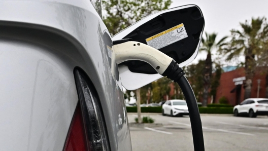 An electric vehicle is charged in Alhambra, California, on April 12, 2023. - US President Joe Biden's administration unveiled new proposed auto emissions rules, aiming to accelerate the electric vehicle transition with a target of two-thirds of the new US car market by 2032. (Photo by Frederic J. BROWN / AFP)