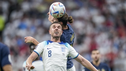 FILE - England's Jordan Henderson, front, heads for the ball with France's Adrien Rabiot during the World Cup quarterfinal soccer match between England and France, at the Al Bayt Stadium in Al Khor, Qatar, Saturday, Dec. 10, 2022. Henderson took plenty of flak when he decided to join the exodus of players moving to Saudi Arabia on lucrative deals, with advocates of LGBTQ+ rights feeling let down by the former Liverpool captain because he has been an outspoken supporter in the past. Six months later and it appears he wants out, with sections of the British media reporting he will consider a return to the Premier League this month after struggling to settle in the Middle East. (AP Photo/Christophe Ena, File)