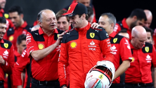 ABU DHABI, UNITED ARAB EMIRATES - NOVEMBER 23: Charles Leclerc of Monaco and Ferrari talks with Ferrari Team Principal Frederic Vasseur at the Ferrari Team Photo during previews ahead of the F1 Grand Prix of Abu Dhabi at Yas Marina Circuit on November 23, 2023 in Abu Dhabi, United Arab Emirates. (Photo by Clive Rose/Getty Images)