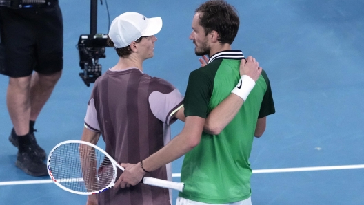 Jannik Sinner, left, of Italy is congratulated by Daniil Medvedev of Russia following the men's singles final at the Australian Open tennis championships at Melbourne Park, in Melbourne, Australia, Sunday, Jan. 28, 2024. (AP Photo/Mark Baker)