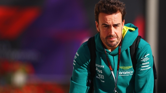 BAHRAIN, BAHRAIN - FEBRUARY 21: Fernando Alonso of Spain and Aston Martin F1 Team looks on in the Paddock during day one of F1 Testing at Bahrain International Circuit on February 21, 2024 in Bahrain, Bahrain. (Photo by Mark Thompson/Getty Images)