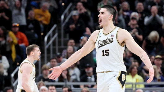 INDIANAPOLIS, INDIANA - MARCH 24: Zach Edey #15 of the Purdue Boilermakers celebrates a basket against the Utah State Aggies during the second half in the second round of the NCAA Men's Basketball Tournament at Gainbridge Fieldhouse on March 24, 2024 in Indianapolis, Indiana.   Andy Lyons/Getty Images/AFP (Photo by ANDY LYONS / GETTY IMAGES NORTH AMERICA / Getty Images via AFP)