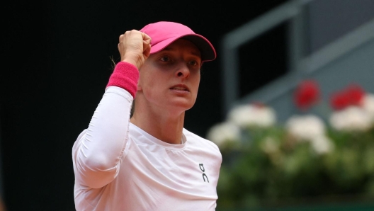 Poland's Iga Swiatek celebrates winning a point against US' Madison Keys during the 2024 WTA Tour Madrid Open tournament semifinal tennis match at Caja Magica in Madrid on May 2, 2024. (Photo by PIERRE-PHILIPPE MARCOU / AFP)