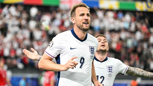 England's forward #09 Harry Kane celebrates scoring his team's first goal during the UEFA Euro 2024 Group C football match between Denmark and England at the Frankfurt Arena in Frankfurt am Main on June 20, 2024. (Photo by JAVIER SORIANO / AFP)