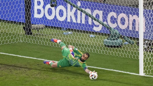 Italy's goalkeeper Gianluigi Donnarumma saves a penalty during the Group B match between Croatia and Italy at the Euro 2024 soccer tournament in Leipzig, Germany, Monday, June 24, 2024. (AP Photo/Sergei Grits)