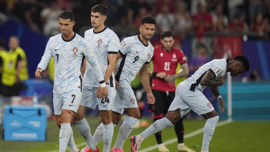 Portugal's Cristiano Ronaldo grimaces as he leaves the pitch during a Group F match between Georgia and Portugal at the Euro 2024 soccer tournament in Gelsenkirchen, Germany, Wednesday, June 26, 2024. (AP Photo/Alessandra Tarantino)