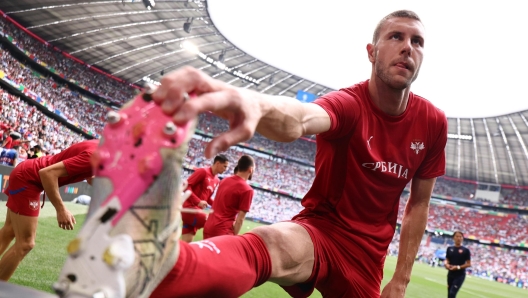 epa11425048 Strahinja Pavlovic of Serbia warms up ahead of the UEFA EURO 2024 Group C soccer match between Slovenia and Serbia, in Munich, Germany, 20June 2024.  EPA/ANNA SZILAGYI