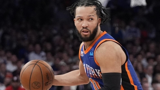 FILE - New York Knicks' Jalen Brunson looks to pass  the ball during the second half of Game 5 in an NBA basketball second-round playoff series against the Indiana Pacers, May 14, 2024, in New York. Brunson has agreed to a four-year contract extension worth about $156.5 million with the Knicks, a person with knowledge of the details said Friday, July 12, 2024. (AP Photo/Frank Franklin II, File)