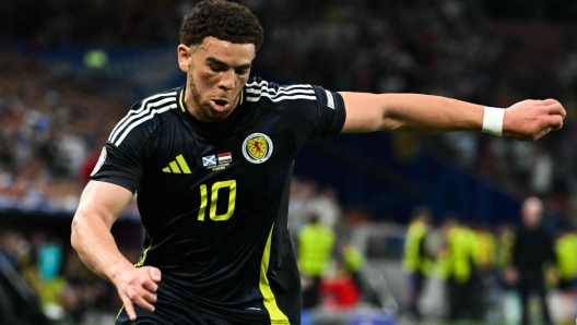 Scotland's forward #10 Che Adams (L) fights for the ball with Hungary's defender #11 Milos Kerkez during the UEFA Euro 2024 Group A football match between Scotland and Hungary at the Stuttgart Arena in Stuttgart on June 23, 2024. (Photo by MIGUEL MEDINA / AFP)