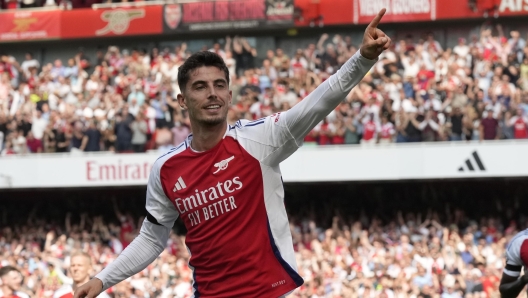 Arsenal's Kai Havertz celebrates after scoring his side's opening goal during the English Premier League soccer match between Arsenal and Wolverhampton Wanderers at Emirates Stadium in London, England, Saturday, Aug. 17, 2024. (AP Photo/Frank Augstein)