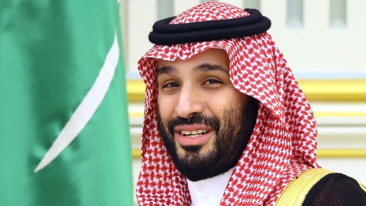 (FILES) This file pool photograph taken on December 6, 2023 and distributed by Russian state agency Sputnik shows Saudi Crown Prince Mohammed bin Salman attending a meeting with Russia's president in Riyadh. Japan's top government spokesman said on May 20, 2024 a planned visit this week by Saudi Arabia's Crown Prince Mohammed bin Salman has been postponed "due to the health condition of King Salman". (Photo by Sergei SAVOSTYANOV / POOL / AFP)