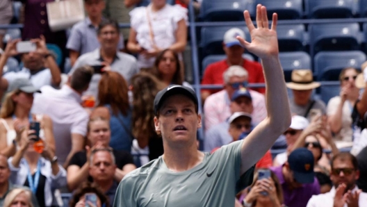 Italy's Jannik Sinner celebrates defeating Alex Michelsen of the US in their men's singles second round tennis match on day four of the US Open tennis tournament at the USTA Billie Jean King National Tennis Center in New York City, on August 29, 2024. (Photo by KENA BETANCUR / AFP)