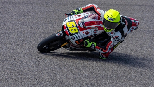 epa11462312 SIC58 Sqadra Corse rider Luca Lunetta of Italy in action during the Moto3 Qualifying for the Motorcycling Grand Prix of Germany, at the Sachsenring racetrack in Hohenstein-Ernstthal, Germany, 06 July 2024. The 2024 Motorcycling Grand Prix of Germany is held on the Sachsenring racetrack on 07 July.  EPA/MARTIN DIVISEK