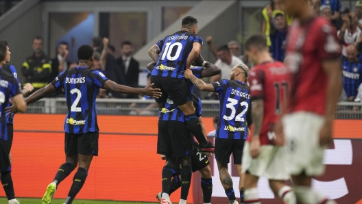 Inter Milan's Marcus Thuram celebrates with teammates after scoring his side's 2nd goal during a Serie A soccer match between Inter Milan and AC Milan at the San Siro stadium in Milan, Italy, Saturday, Sept.16, 2023. (AP Photo/Antonio Calanni)