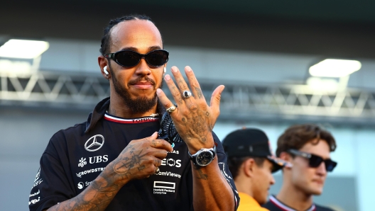 SINGAPORE, SINGAPORE - SEPTEMBER 22: Lewis Hamilton of Great Britain and Mercedes looks on from the drivers parade prior to the F1 Grand Prix of Singapore at Marina Bay Street Circuit on September 22, 2024 in Singapore, Singapore. (Photo by Mark Thompson/Getty Images)