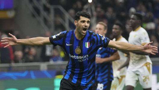 Inter Milan's Mehdi Taremi celebrates after scoring his side's fourth goal from penalty spot during the Champions League opening phase soccer match between Inter Milan and Red Star, at the San Siro stadium in Milan, Italy, Tuesday, Oct. 1, 2024. (AP Photo/Luca Bruno)