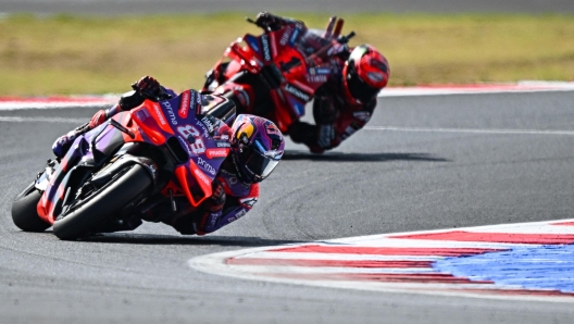 Ducati Spanish rider Jorge Martin rides ahead of Ducati Italian rider Francesco Bagnaia during the sprint race of the San Marino MotoGP Grand Prix at the Misano World Circuit Marco-Simoncelli in Misano Adriatico on September 7, 2024. (Photo by GABRIEL BOUYS / AFP)