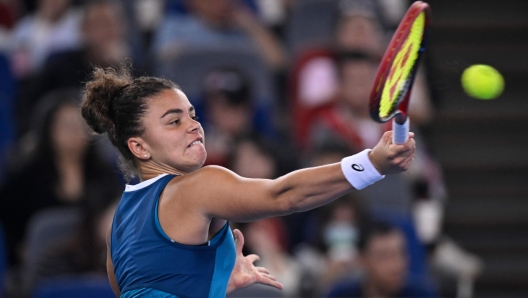 Italy's Jasmine Paolini hits a return to China's Yuan Yue during women's singles match at the Wuhan Open tennis tournament in Wuhan, China's Hubei province on October 9, 2024. (Photo by WANG Zhao / AFP)