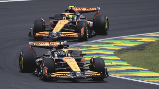 McLaren driver Oscar Piastri of Australia, bottom, and McLaren driver Lando Norris of Britain steer their cars during the sprint race ahead of the Brazilian Formula One Grand Prix auto race at the Interlagos racetrack in Sao Paulo, Saturday, Nov. 2, 2024. (AP Photo/Ettore Chiereguini)