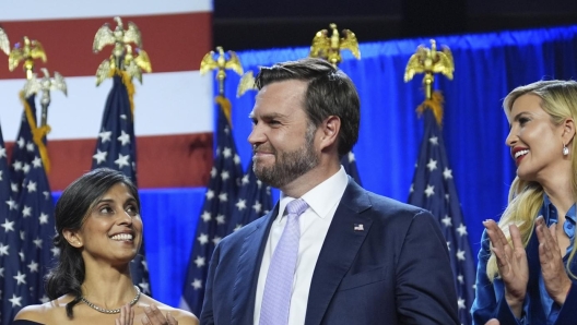 Republican vice presidential nominee Sen. JD Vance, R-Ohio, smiles as from left, Viktor Knavs, Usha Vance, Ivanka Trump and Jared Kushner watch as Republican presidential nominee former President Donald Trump speaks at an election night watch party at the Palm Beach Convention Center, Wednesday, Nov. 6, 2024, in West Palm Beach, Fla. (AP Photo/Evan Vucci)