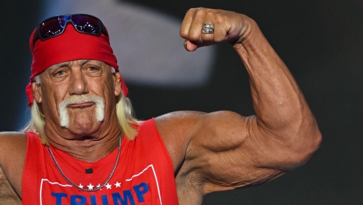 US pro-wrestler Hulk Hogan flexes his muscles after speaking during the last day of the 2024 Republican National Convention at the Fiserv Forum in Milwaukee, Wisconsin, on July 18, 2024. Donald Trump will get a hero's welcome Thursday as he accepts the Republican Party's nomination to run for US president in a speech capping a convention dominated by the recent attempt on his life. (Photo by ANDREW CABALLERO-REYNOLDS / AFP)