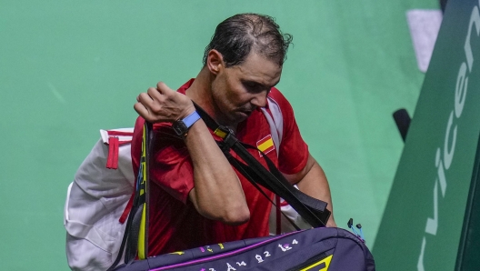 Spain's tennis player Rafael Nadal leaves the court after losing against Netherlands' Botic Van De Zandschulp during a Davis Cup quarterfinal match at Martin Carpena Sports Hall in Malaga, southern Spain, on Tuesday, Nov. 19, 2024. (AP Photo/Manu Fernandez)