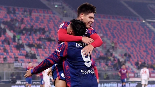 BOLOGNA, ITALY - DECEMBER 03: Benjamin Dominguez of Bologna celebrates with teammate Santiago Castro after scoring his team's third goal during the Coppa Italia match between Bologna FC and AC Monza at Renato Dall'Ara Stadium on December 03, 2024 in Bologna, Italy. (Photo by Alessandro Sabattini/Getty Images)