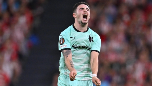 Slavia's Christos Zafeiris shouts during the Europa League opening phase soccer match between Athletic Club and Slavia at the San Mames stadium in Bilbao, Spain, Thursday, Oct. 24, 2024. (AP Photo/Miguel Oses)