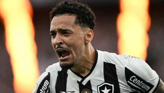 Botafogo's midfielder #26 Gregore celebrates after scoring during the Brasileirao Seria A football match between Botafogo and Sao Paulo at the Nilton Santos Olympic stadium in Rio de Janeiro, Brazil, on December 8, 2024. (Photo by Mauro PIMENTEL / AFP)