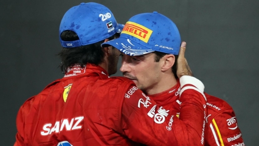 epa11765026 (L-R) Second placed Scuderia Ferrari driver Carlos Sainz Jr. of Spain and third placed Scuderia Ferrari driver Charles Leclerc of Monaco celebrate on the podium after the Formula One Abu Dhabi Grand Prix, at the Yas Marina Circuit racetrack in Abu Dhabi, United Arab Emirates, 08 December 2024.  EPA/ALI HAIDER