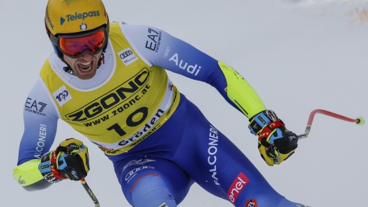 Italy's Mattia Casse gets to the finish area after completing an alpine ski, men's World Cup Super-G in Val Gardena, Italy, Friday, Dec. 20, 2024. (AP Photo/Alessandro Trovati)