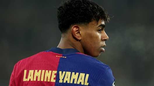 DORTMUND, GERMANY - DECEMBER 11: Lamine Yamal of FC Barcelona looks on during the UEFA Champions League 2024/25 League Phase MD2 match between Borussia Dortmund and FC Barcelona at BVB Stadion Dortmund on December 11, 2024 in Dortmund, Germany. (Photo by Lars Baron/Getty Images)