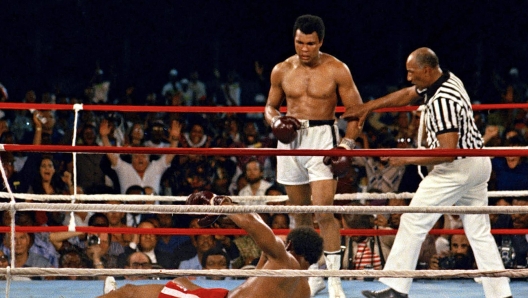 Muhammad Ali looks down at George Foreman during their bout in Kinshasa, Zaire, Oct. 30, 1974.  (AP Photo)