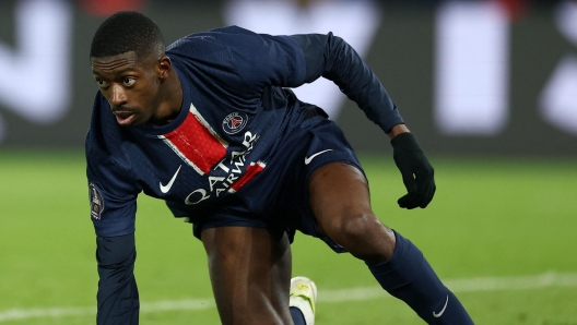 Paris Saint-Germain's French forward #10 Ousmane Dembele gets up after falling to the ground during the French L1 football match between Paris Saint-Germain (PSG) and AS Saint-Etienne at the Parc des Princes Stadium in Paris on January 12, 2025. (Photo by FRANCK FIFE / AFP)