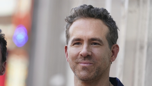 FILE - Ryan Reynolds attends a ceremony honoring Kevin Feige with a star on the Hollywood Walk of Walk of Fame, July 25, 2024, in Los Angeles. (Photo by Jordan Strauss/Invision/AP, File)