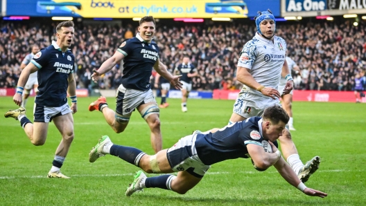 Scotland's centre Huw Jones scores a try during the Six Nations international rugby union match between Scotland and Italy at Murrayfield Stadium in Edinburgh, Scotland on February 1, 2025. (Photo by ANDY BUCHANAN / AFP)