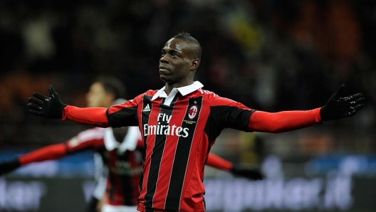 MILAN, ITALY - FEBRUARY 03: Mario Balotelli of AC Milan celebrates after scoring his second goal from the penalty spot during the Serie A match between AC Milan and Udinese Calcio at San Siro Stadium on February 3, 2013.