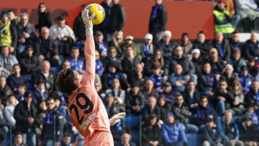 Atalanta’s goalkeeper Marco Carnesecchi saves on Venezia`s Alessio Zerbin