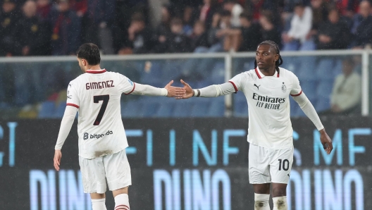 Rafael Leao and Santiago Gimenez celebrate a goal during a Serie A match.